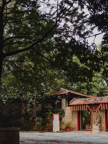 The beautiful, rustic entrance to The Tamarind Tree, a venue we love to decorate, hinting at the natural beauty within.