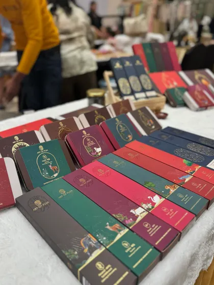 A close-up of the colourful and elegant packaging for 'Art of Puja' products, showing the quality of brands we host.