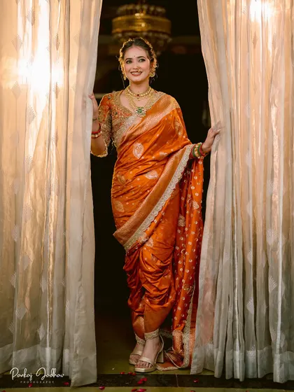 The bride framed by curtains, a simple yet elegant portrait that plays with light and shadow.