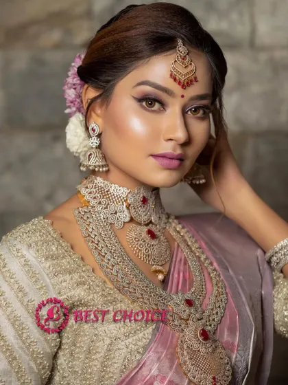 A close-up portrait highlighting the beautiful makeup and the intricate details of our ruby and diamond-look choker and jhumkas.
