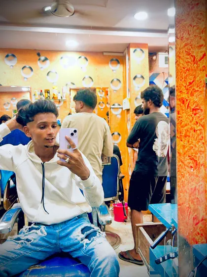 A client taking a selfie right after I finished his haircut. Capturing that fresh-from-the-chair feeling is part of the experience.