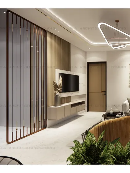 A sleek, modern TV unit and a stylish metal partition define this living space, demonstrating how I balance functionality with contemporary design.