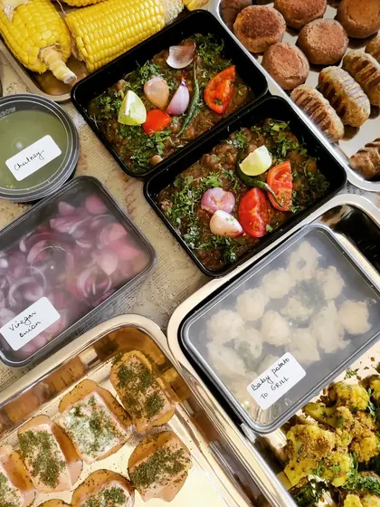 A 'Ready to Grill' North Indian platter, including Tandoori Gobi, assorted kebabs, Amritsari Kulcha, and Smoked Chana, with all the necessary chutneys and toppings.