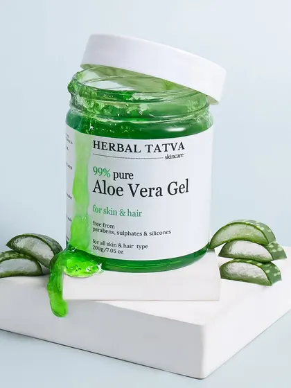 A texture shot focusing on the 99% pure Aloe Vera Gel. The overflowing gel and fresh aloe pieces create a rich, tactile image that effectively communicates the product's purity and consistency.