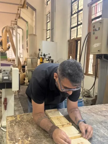 A student inspects the alignment of glued-up pieces for a box project. Patience and attention to detail are key to a successful glue-up.