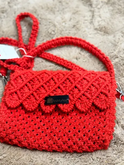 A bright red sling bag that's ready to go! This color is always a popular choice.