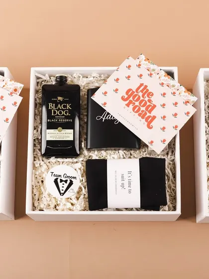 Three groomsmen boxes lined up, showcasing the sleek black and white theme. It's a classic and sophisticated gift for your best men.