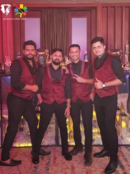 Our team in stylish red vests for a magical wedding celebration. We coordinate our uniforms to match the event's color scheme and theme.