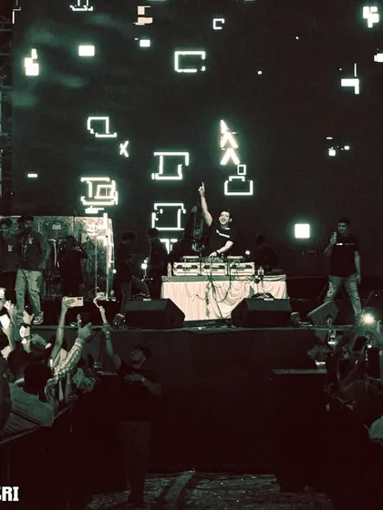A wide shot of the massive stage setup and the crowd at the AatmTrisha music festival.