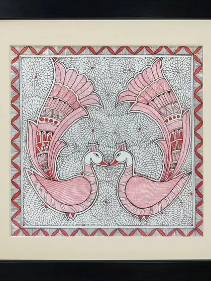 A pair of pink swans touch beaks in this symmetrical Madhubani painting by Rinki Joshi. The background is filled with a dense, fine-lined pattern, creating a beautiful contrast with the simple elegance of the birds.