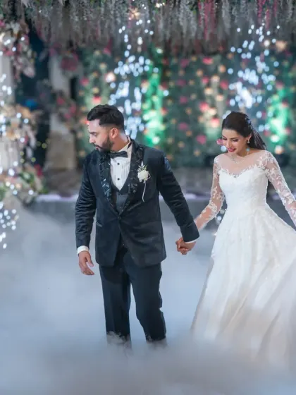Creating a fairytale first dance moment. With a bit of smoke and dramatic lighting, we can turn your wedding reception into a scene from a movie. It’s all about making your big day unforgettable.