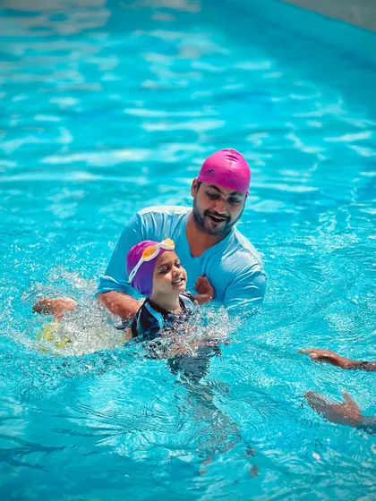 Our coaches work closely with each child, offering encouragement and a steady hand. This interaction is crucial for building confidence in our infant and toddler swim classes.
