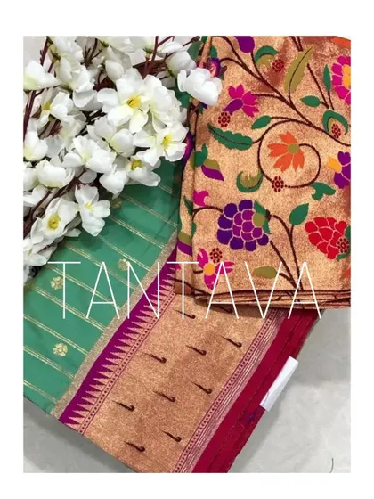 A flat-lay of the fabric for the custom Paithani blouse, showing the vibrant floral brocade that was chosen to complement the saree's traditional motifs.