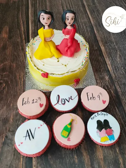 I made this set for two best friends celebrating their bachelorette parties together. The cake features 3D fondant figures of them, with cupcakes marking their special dates.