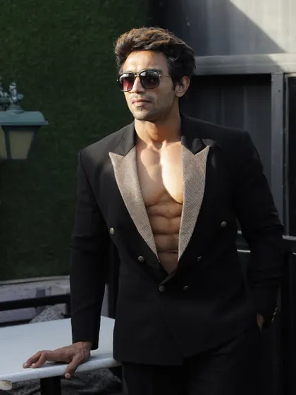 A throwback photo, showing my physique in a stylish suit.