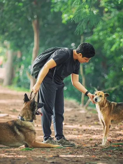 Here I am with two of my favorites, Floyd and a sweet community dog named Bhoori. This image captures my love for all dogs, not just my own. I believe in fostering positive relationships and coexisting peacefully with the community dogs around us.