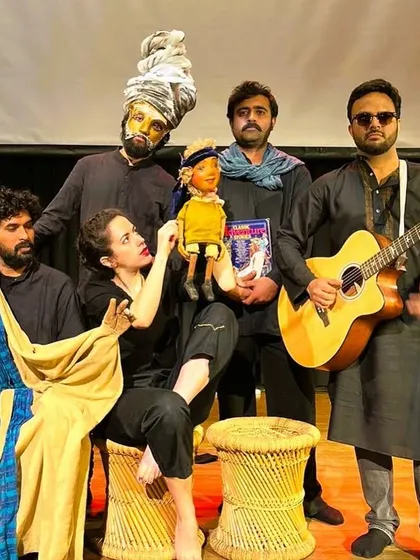 A playful group photo of the 'Buried Treasures' cast and their puppets. This image reflects the fun and collaborative nature of our ensemble, where actors, musicians, and puppets share the stage.