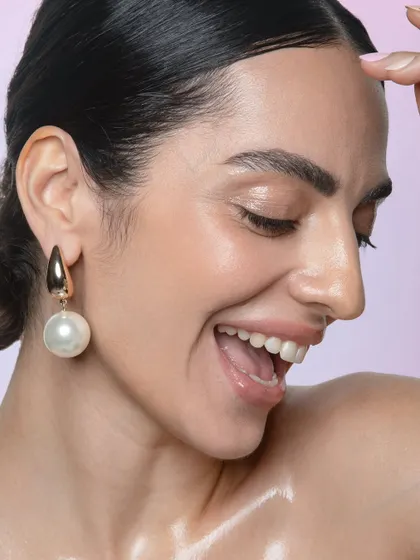 A happy, smiling shot that radiates warmth. The makeup is fresh and luminous, perfect for capturing genuine emotion.