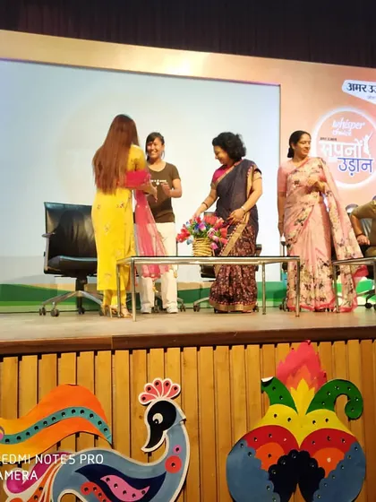 Being recognized on stage at the 'Amar Ujala - Sapno Ki Udaan' event. It is an honor to contribute to a cause that helps women achieve their dreams.