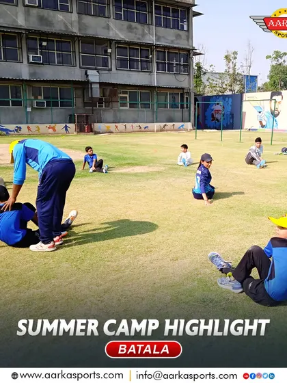 A coach assists a student with a stretching exercise during the summer camp. I ensure my coaches provide personalized attention to each player's fitness needs.
