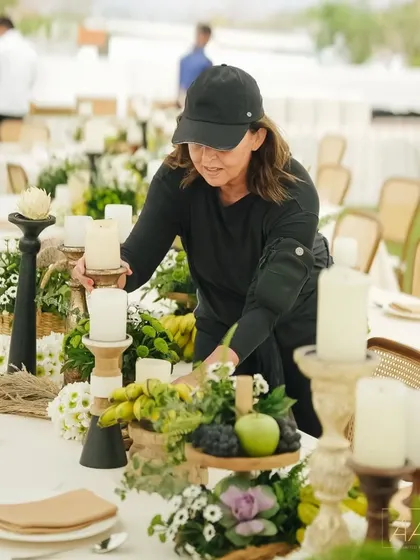 A member of my talented team carefully arranging a centerpiece for our 'Easy Breezy Brunch'. Every detail is thoughtfully placed to create a look of effortless elegance.
