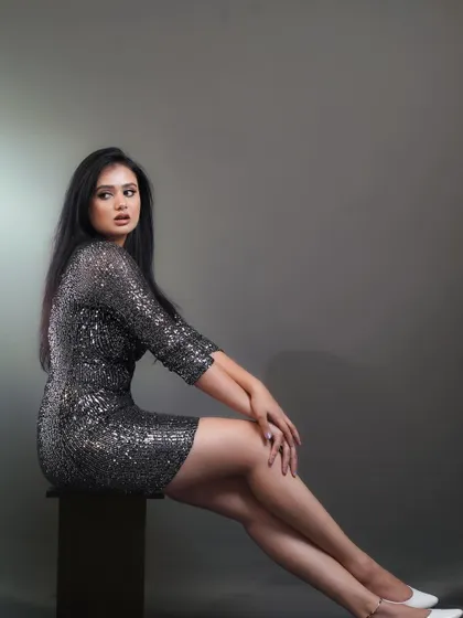 A classic full-length portrait for a modeling portfolio. The simple pose and clean background ensure the focus remains on the model and the outfit.