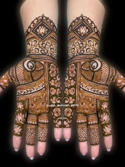 A very detailed and symmetrical design for both hands, featuring a mix of modern geometric and traditional floral elements.
