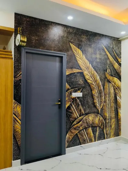 I love creating designs that have depth and texture. This 3D-effect wallpaper with golden leaves adds a touch of luxury and drama to this entryway, making a bold statement right from the entrance.
