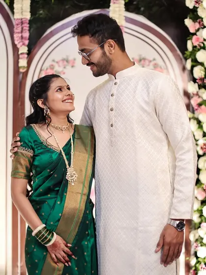 A candid shot capturing a loving gaze between an engaged couple during their photoshoot.