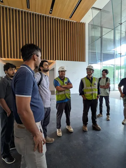 Our team members during a site visit to the Godrej Koregaon Park campus in Pune. Dressed in safety gear, they get a firsthand look at the construction progress of this 1.9 million sq. ft. project.