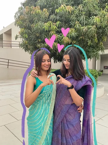 Saree twinning with my bestie. The purple and blue doodles connect us and add a fun, friendly vibe to the photo.