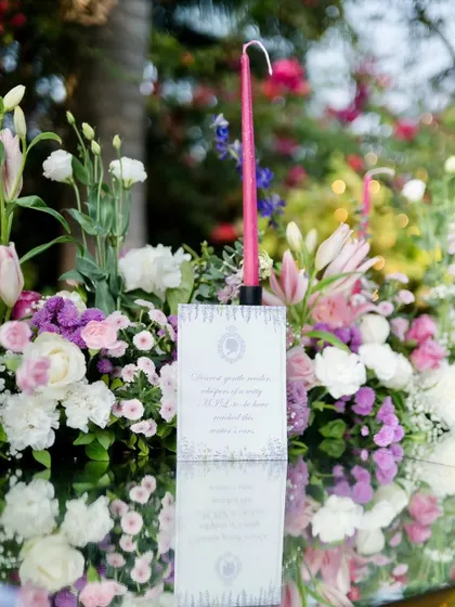 Here you can see a custom menu card placed within the floral arrangement. I pay close attention to these small details to ensure a fully branded and seamless experience at corporate functions.