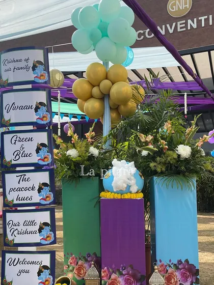 A themed signpost welcoming guests to the celebration of 'Our little Krishna'.