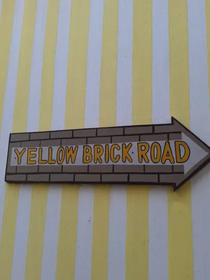 The famous "Yellow Brick Road" sign, pointing the way to a delightful meal.