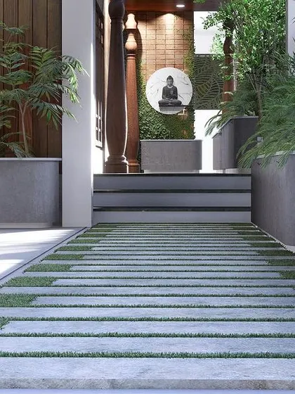 The pathway design, featuring stone slabs interspersed with grass, leading to the main door.