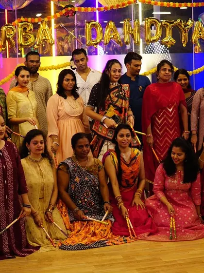 The whole team posing with their dandiya sticks. This shows the scale of the group performances we can handle.