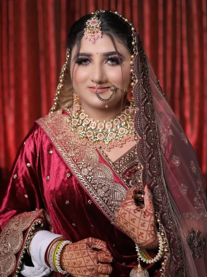 A beautiful, smiling portrait of the bride. We focus on capturing the genuine happiness of our brides on their special day.
