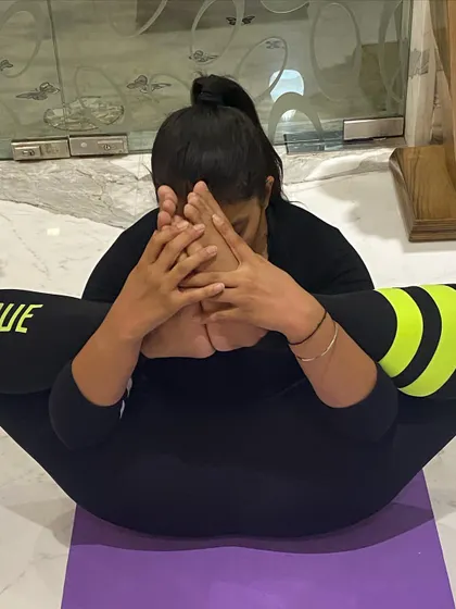 Here is a variation of the Bound Angle Pose where I am bringing my feet closer to my face. This deep stretch is something we can work towards over time to increase hip flexibility.