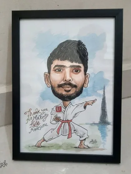 The final framed piece of a karate-themed caricature, a creative way to recognize an employee's passions.