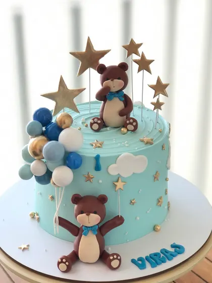 A single-tier version of the teddy bear and stars cake, perfect for a smaller celebration.