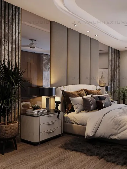 A side view of the Rajouri bedroom, showcasing the layered textures of the headboard and the elegant bedside lighting.