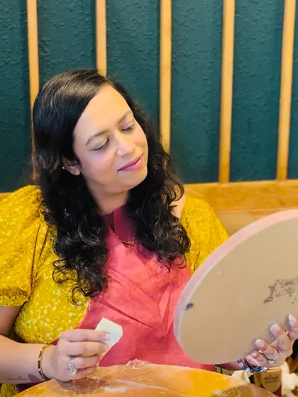 Lost in the creative flow. A participant carefully inspects her work, adding the final touches to her personalized moon lamp.