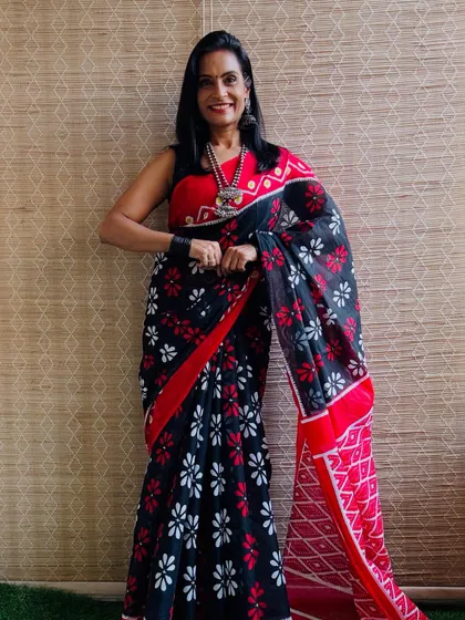 This black and red floral block print saree is a beautiful and bold choice. The color combination is classic and striking.