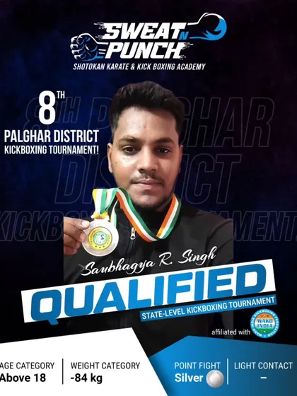 Saubhagya R. Singh, a competitor in the Above 18 adult category, after winning his silver medal. Our adult kickboxing classes are perfect for improving fitness and learning self defense.