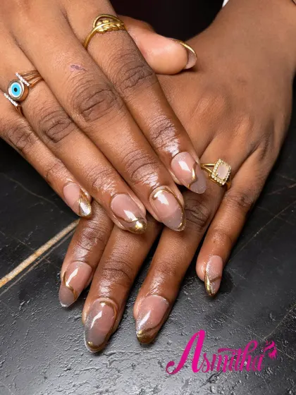This photo showcases the sleek shape and flawless application of our gel extensions, with the gold chrome tip providing a clean, reflective finish.