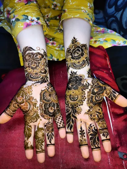 A beautiful design with bold rose motifs and delicate leafy patterns. The contrast is striking.