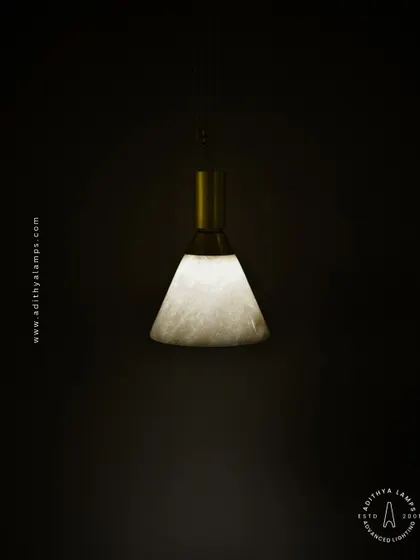 A simple yet elegant cone-shaped pendant light. The shade is crafted from marble, providing a warm, diffused downlight that is perfect for task lighting over kitchen counters, reading nooks, or as accent lighting.
