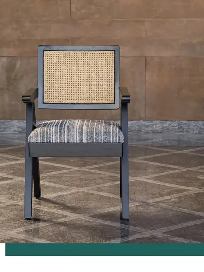 Our contemporary version of the classic Chandigarh Chair. Crafted from sustainably certified oak wood with a cane back, this piece pays homage to Pierre Jeanneret's iconic design while fitting perfectly into modern, elegant interiors.