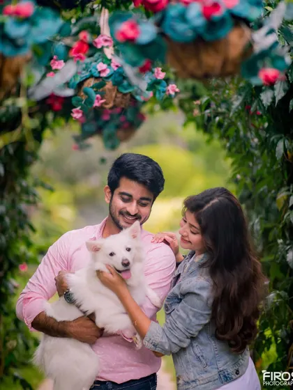 A duplicate of the previous image, emphasizing the bond between the couple and their pet.