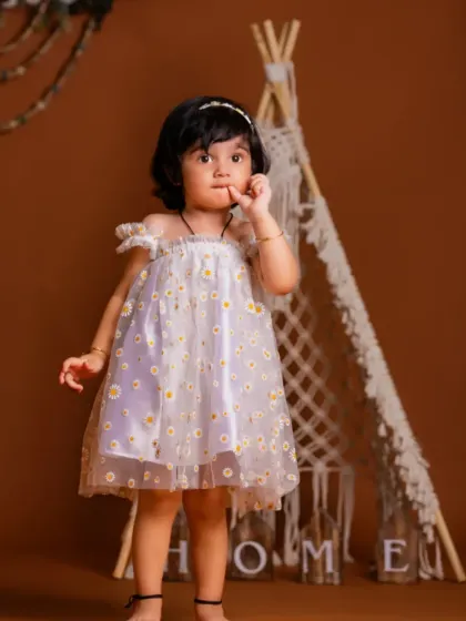 A tiny explorer in our studio. The combination of the delicate dress and the rustic teepee is simply beautiful.